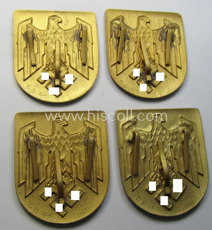 Superb, WH (KM) tropical- (ie. 'DAK'- or: 'Deutsches Afrikakorps'-) related- and/or zinc-based, eagle-'pith-helmet'-shield being a maker- (ie. 'G.B.-41'-) marked example that comes in a very nice- (ie. 'virtually mint- ie. unissued'-), cond...