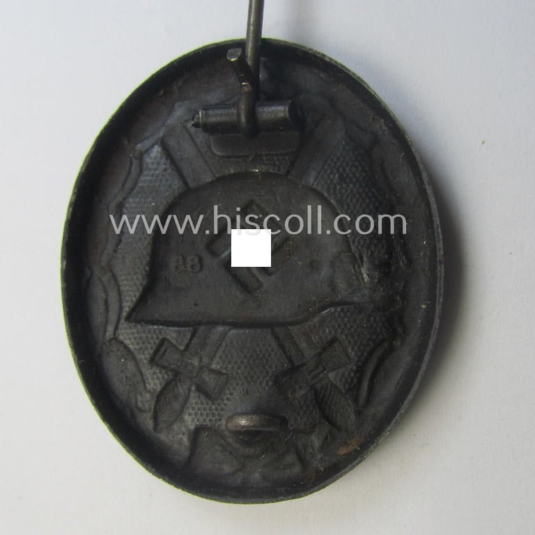 Moderately used and/or neatly maker- (ie. '88'-) marked example of a black-class wound-badge (or: 'Verwundeten-Abzeichen in Schwarz') being an example that was produced by the desirable maker (ie. 'Hersteller') named: 'Werner Redo'