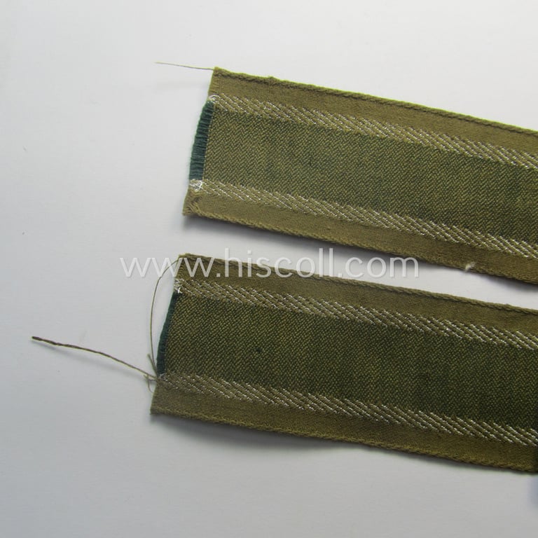 'BeVo'-like cuff-title (ie. 'Ärmelstreifen') entitled: 'Afrikakorps' being a presumably issued but simply never worn example that comes in an overall very nice- (ie. non-shortened- and never tunic-attached-), condition