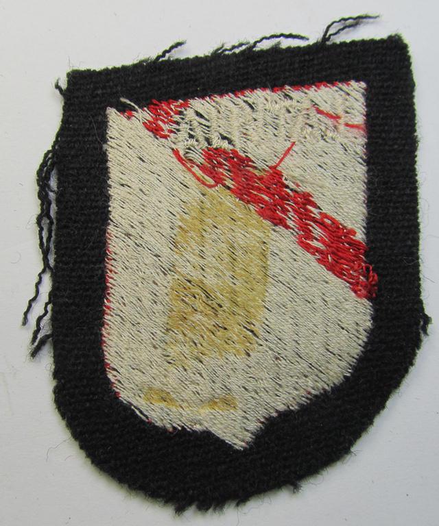 Waffen-SS 'volunteer'-arm-shield as was intended for usage by soldiers of the: '15. o. 19. Waffen-Grenadier-Division der SS' (ie. 'lettische nr. 1 o. 2') and that comes in a 'virtually mint- ie. unissued', condition
