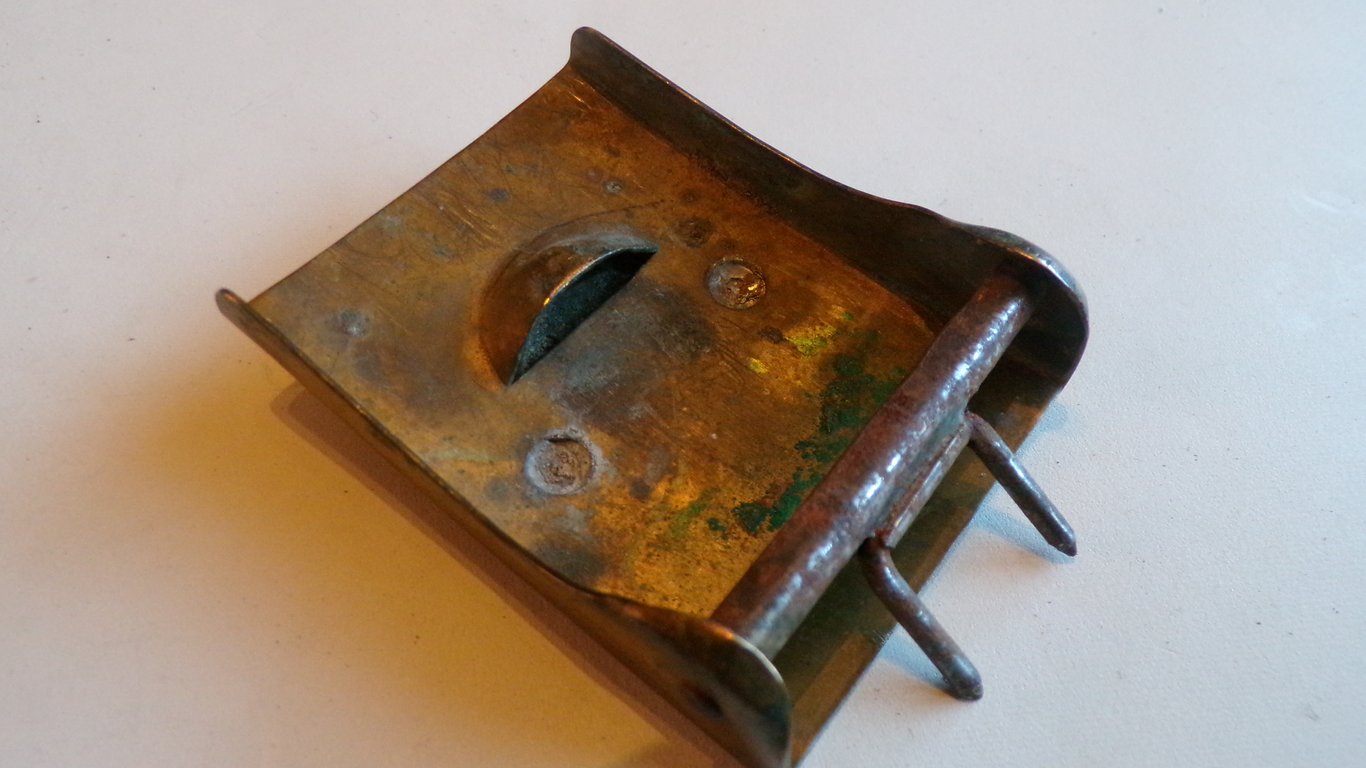 S.A brown leather belt and buckle