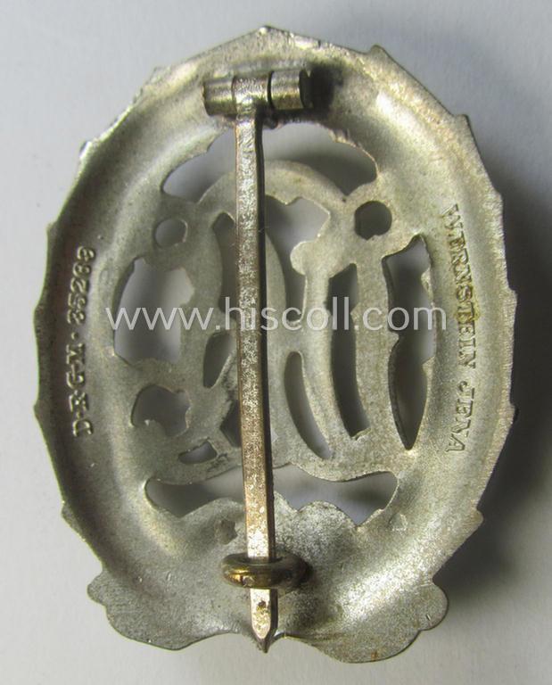 'Reichssportabzeichen DRL in Silber' (or: DRL sports'-badge in silver) being a just moderately worn- ie. used example that is nicely maker- (ie. 'Wernstein - Jena'-) marked on its back