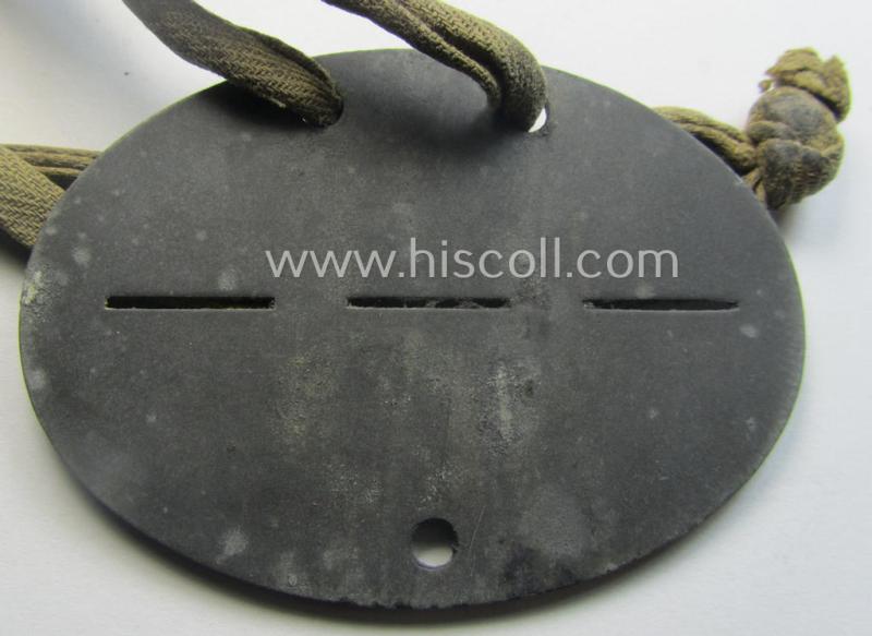 Zinc-based, 'Deutsche Reichsbahn'- (ie. DRB-) related ID-disc bearing the clearly stamped unit-designation that simply reads: 'HVD Paris' and that comes as issued and/or worn