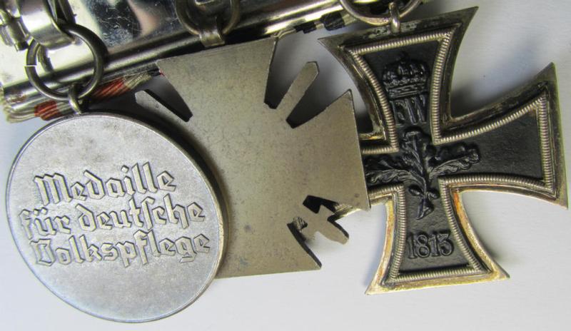 Attractive, WWI- (ie. TR-) period so-called: 'Ordenspange' (being of the desirable 'detachable'-pattern!) showing resp. an: 'EK II. Kl.'. a: 'FKK 1914-18 mit Schw.' and a: 'Deutsche Volkspflege'- (ie. civil-service-) medal