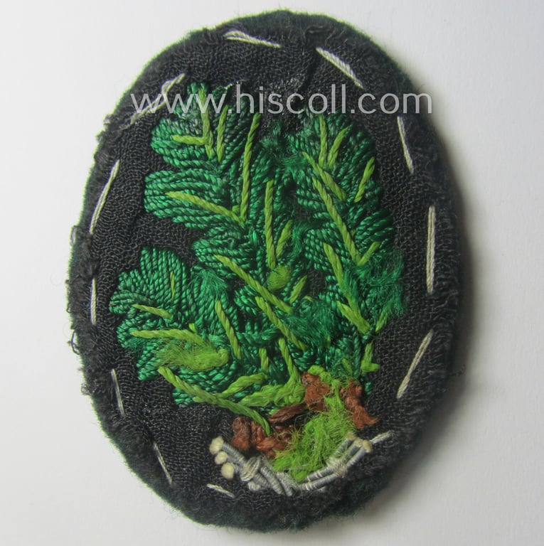 Superb - and just moderately used! - WH (Heeres) neatly hand-embroidered- and/or typical officers'- (ie. 'variant'-) pattern so-called: 'Jäger'-arm-badge (as specifically intended for usage by an officer serving within the 'Jäger-Trpn.')