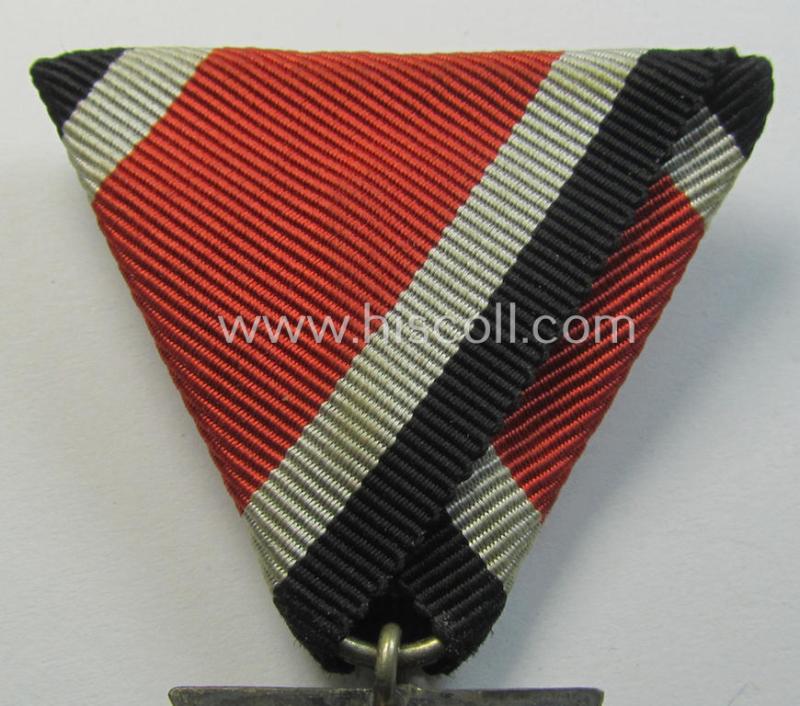 Neat, Iron Cross 2nd class (or: 'EK II. Klasse') being a non-maker-marked example that comes mounted onto its original (Austrian-styled!) ribbon (ie. 'Bandabschnitt') as was (I deem) produced by the (Austrian-based) company named: 'Rudolf Souval...