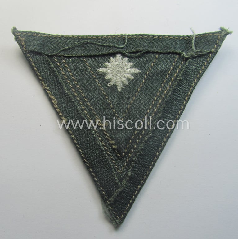 WH (Heeres) 'Armwinkel' (or: arm-chevron) as was executed on a greenish-coloured- and/or 'HBT'-like (ie. 'Drillich'-) based background as was specifically intended for usage by a soldier with the (unusually encountered!) rank of a: 'Stabsgefreiter'