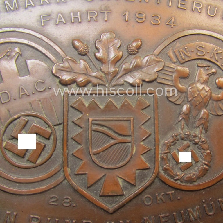 Commemorative N.S.K.K.-/D.D.A.C.-related car-plaque (ie. 'Erinnerungs- o. nichttragbare Kfz-plakette') showing a towns'-shield, N.S.K.K.- and/or D.D.A.C.-logos and text: 'Nordmark Orientierungsfahrt - 300 Minuten rund um Neumünster - 23. Okt.1934'