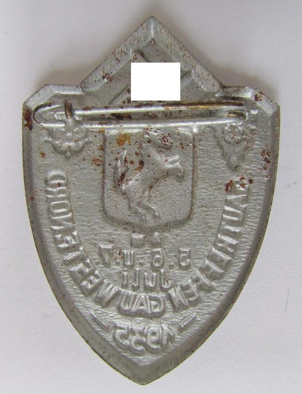 Commemorative, silver-coloured N.S.D.A.P.-related day-badge (ie. 'Veranstaltungsabzeichen' or: 'tinnie') being a non-maker-marked example depicting a provincial-armshield surrounded by the text: 'Gautreffen Gau Westf. Nord - 5.6.u.7. Juli 1935'