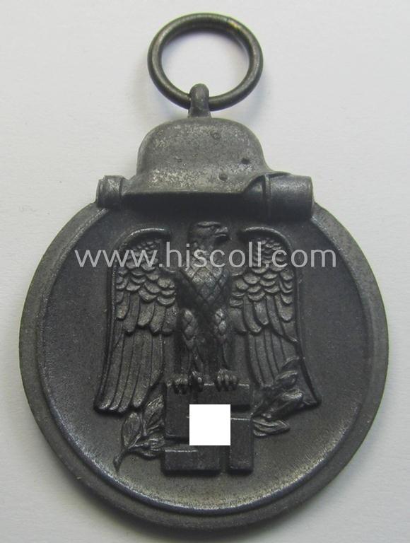 Neatly maker- (ie. '19'-) marked medal: 'Winterschlacht im Osten 1941/42' that came stored in its period pouch by the company: 'E. Ferd. Wiedmann'