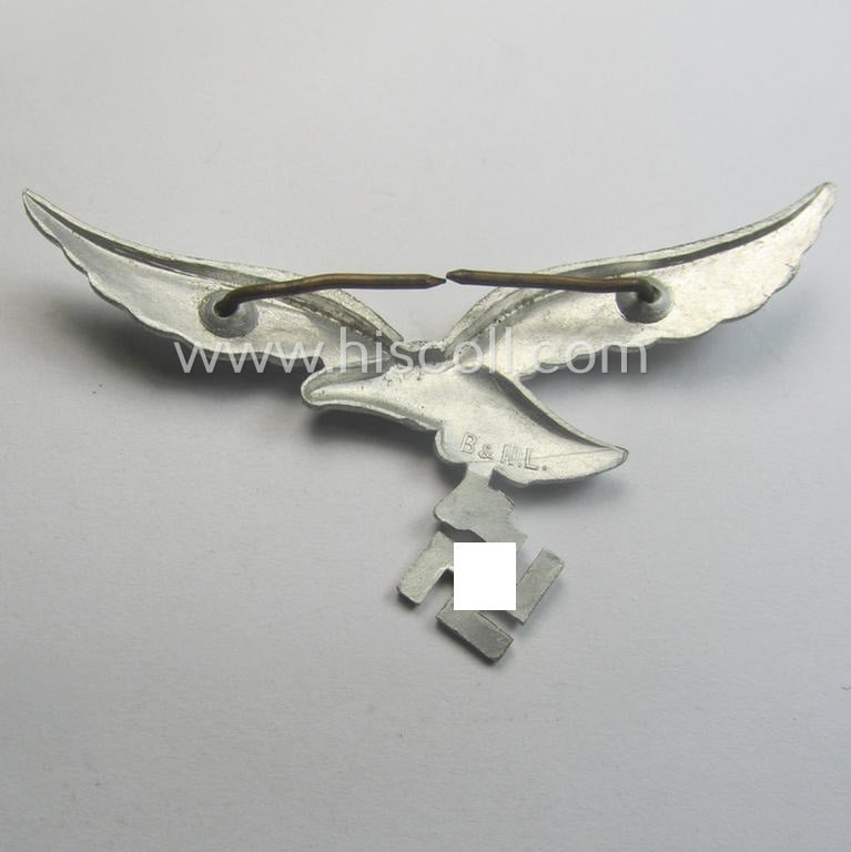 Minimally worn, WH (Luftwaffe) EM/NCO-pattern visor- (ie. 'Schirmmützen'-) cap-eagle being clearly maker- (ie. 'B.&N.-L.'-) marked example as executed in aluminium-based metal
