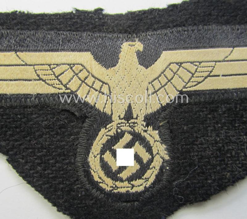 'Cut-out of a wrap-around-tunic' - WH (Heeres) 'Panzer' EM- (ie. NCO-) type breasteagle (ie. 'Brustadler für Mannschaften und Unteroffiziere des Heeres')