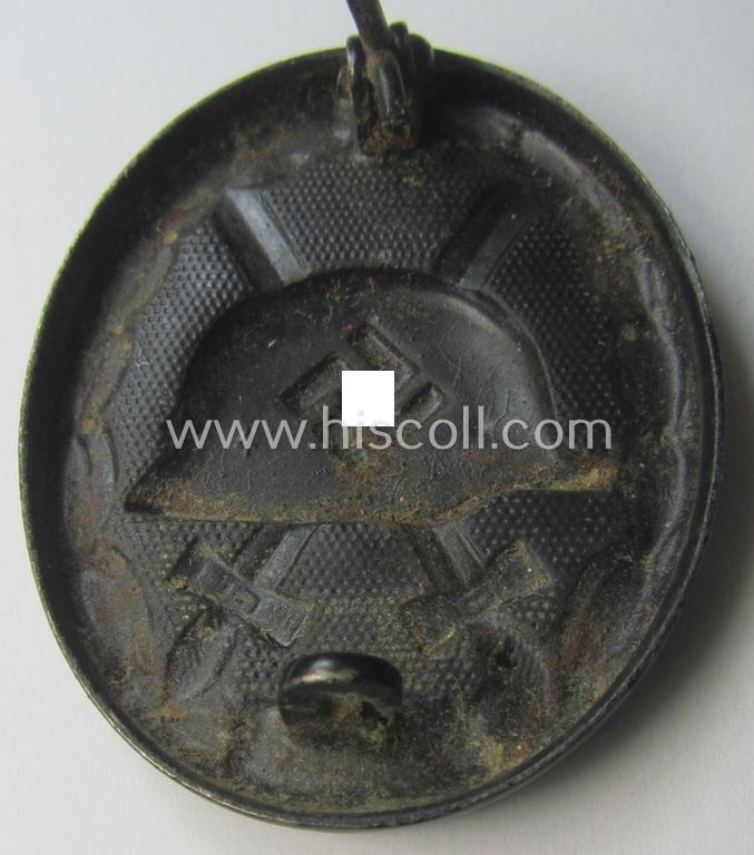 Black-class wound-badge (or: 'Verwundeten-Abzeichen in Schwarz') being a maker- (ie. '4'-) marked specimen as was produced by the maker (ie. 'Hersteller') named: 'Steinhauer & Lück'