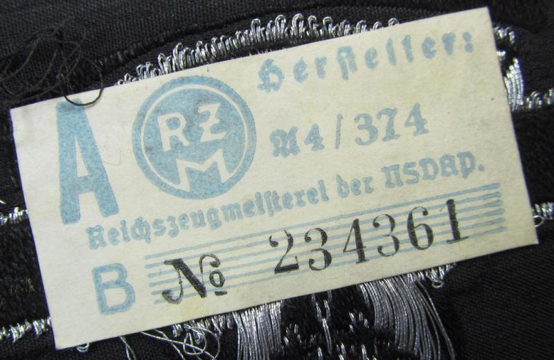 Attractive and typically 'BeVo flat-wire'-woven, so-called: N.S.K.K. (ie. 'National Socialistisches Kraftfahr Korps') arm-eagle being a very detailed- and/or 'virtually mint' example that still retains its period-attached 'RzM'-etiket