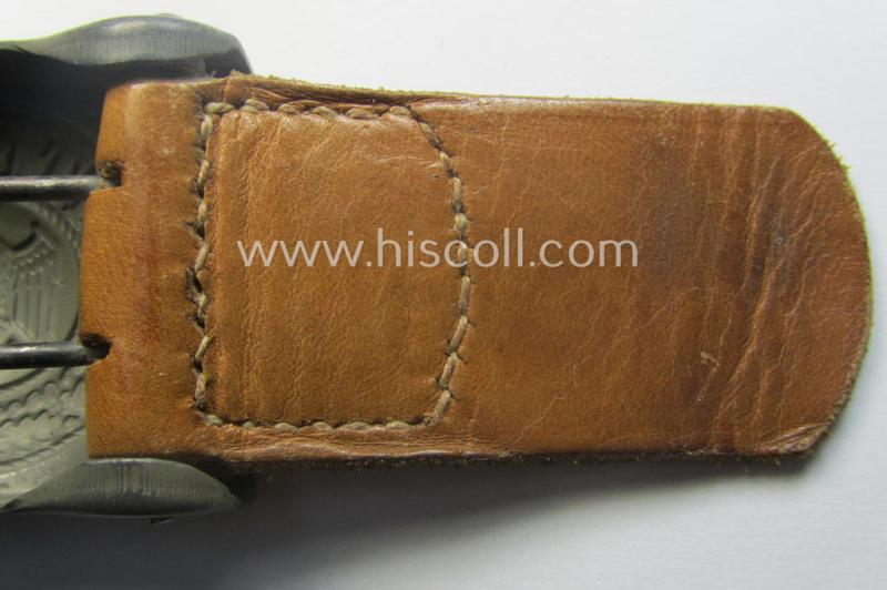 'Virtually mint', 'standard-issue'-pattern, WH (Heeres) field-grey-toned- and steel-based belt-buckle being a non-maker-marked example that comes mounted onto its 'G.H. Osang'-marked and/or '1940'-dated tab