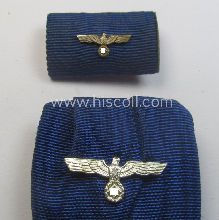 Silver-toned WH (Heeres o. KM) so-called: 'Einzelspange' showing a: 'WH-Dienstauszeichnung 4. Stufe' (as was intended for 4 years of loyal-service) and that shows a detailed, Heeres o. KM-type-eagle-device, period-attached