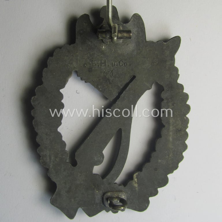 'Infanterie Sturmabzeichen in Silber' (or: silber-class infantry assault-badge ie. IAB) being a maker- (ie. 'S.H.u.C.o. 41'-) marked example as executed in bronze-toned, zinc-based metal (ie. 'Feinzink')