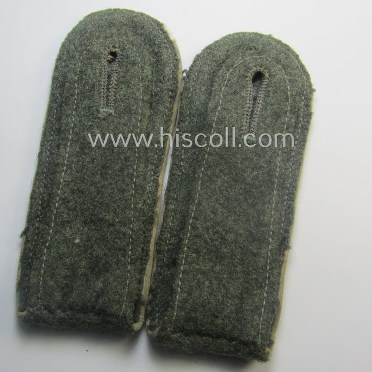 Moderately used pair of WH (Heeres), early- (ie. mid-) war-period- (ie. 'M41- o. M43'-) pattern EM-type shoulderstraps as piped in the white-coloured branchcolour as was intended for a: 'Soldat eines Infanterie-Rgts.'