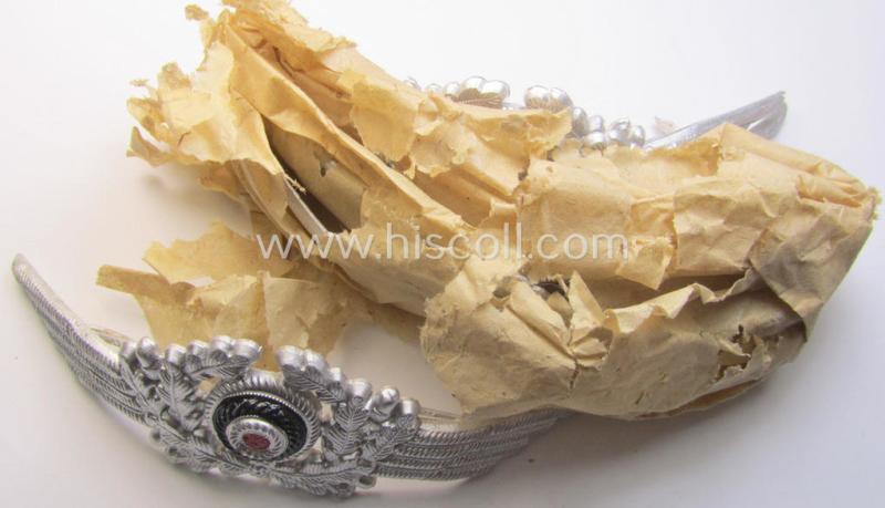 WH (Luftwaffe) related (and aluminium-based!) visor-cap-cocarde (ie. 'Schirmmützenkokarde für Uffz. u. Mannschaften der Luftwaffe) being a very nice example that comes in a 'virtually mint- ie. unissued'-, condition
