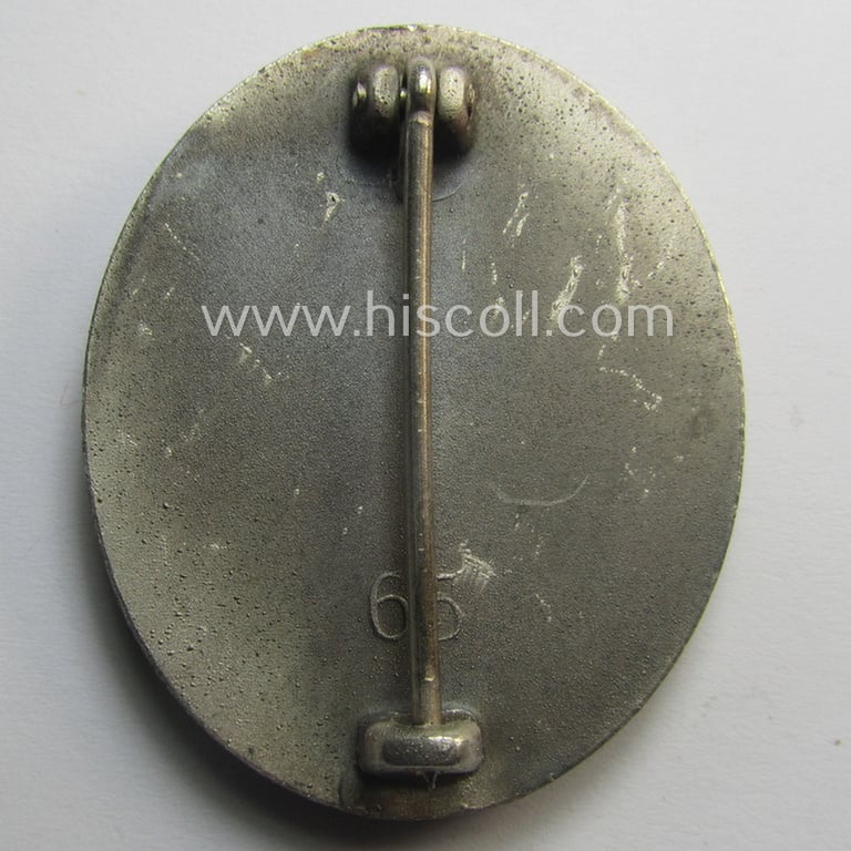 Complete, silver-class wound-badge- (or: 'Verwundeten-Abzeichen in Silber'-) set comprising of a maker- (ie. '65'-) marked example (and miniature!) as produced by the 'Hersteller' ie. maker: 'Klein u. Quenzer'