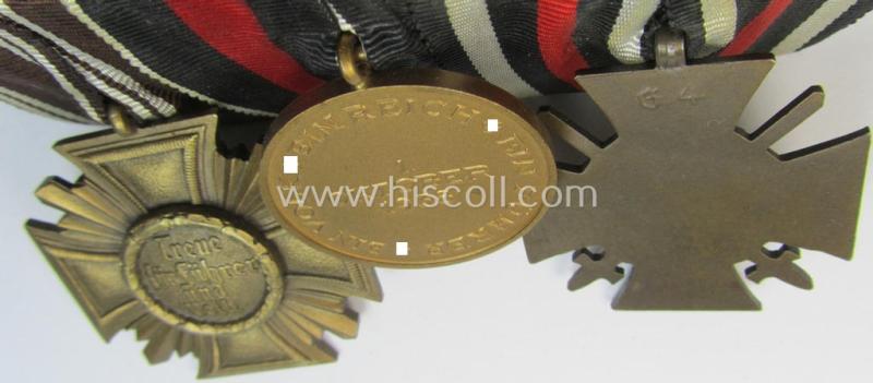 Superb, 3-pieced N.S.D.A.P.-related medal-bar (ie. 'Ordenspange') showing resp. an: 'FKK 1914-18 mit Schw.', a: Czech 'Anschluss' medal and a: 'N.S.D.A.P.-DA. in Bronze' (ie. '3. St. für 10 Jahre t. D.')