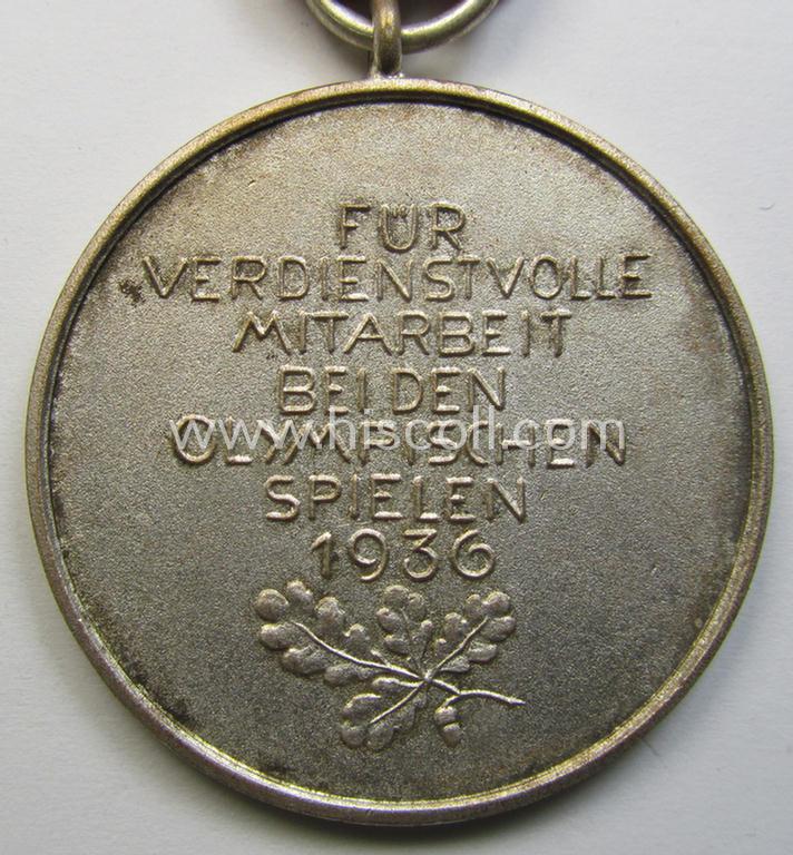 Superb, 'Deutsche Olympia-Erinnerungsmedaille 1936' being a non-maker-marked example that comes mounted onto its original ribbon (ie. 'Bandabschnitt') and that comes stored in its typical, beige-white-coloured etui as issued and stored for decade...