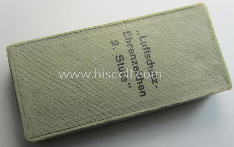 Light-weight (ie. typical aluminium-based) medal as was intended for air-raid wardens 2nd. class (or: 'Luftschutz-Ehrenzeichen 2. Stufe') that comes stored in its period, dove-grey-coloured etui