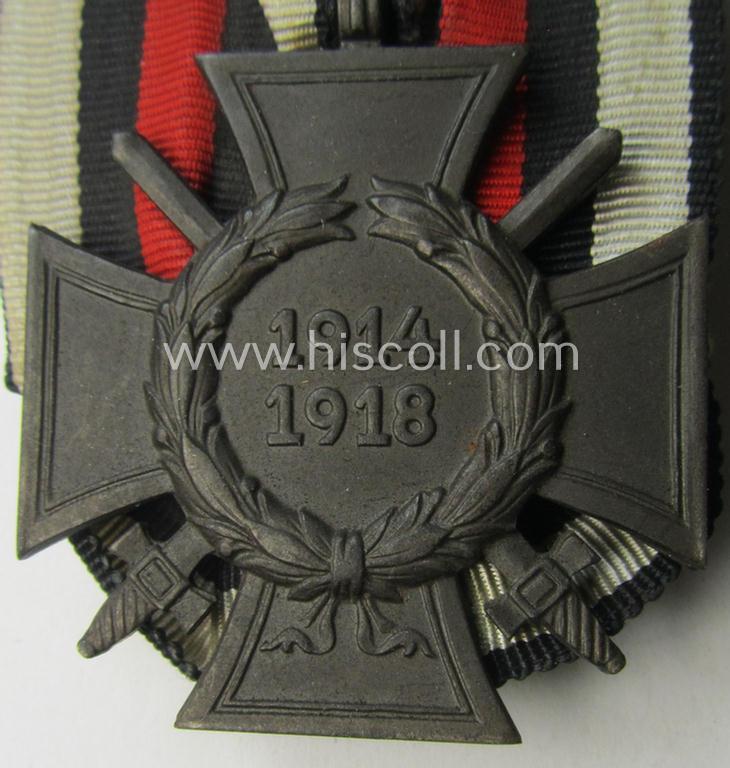 Neat, golden-bronze-toned so-called: 'Einzelspange' showing a: 'Frontkämpferkreuz 1914-18 mit Schwertern' (ie.: 'Kriegsteilnehmerkreuz 1914-18 mit Schw.') being a detailed- and/or zinc- ie. 'Feinzink'-based, specimen