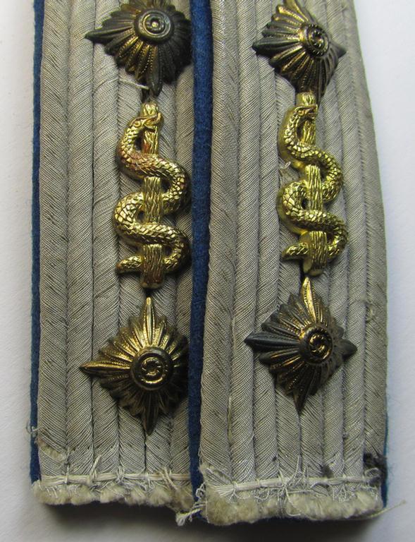 Attractive - and fully matching! - pair of WH (Heeres) neatly 'cyphered', officers'-type shoulderboards as piped in darker-blue-coloured branchcolour as was intended for usage by a: 'Hauptmann u. Arzt' who served within the: 'Sanitäts-Truppen'