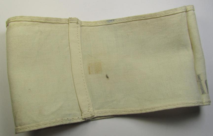 Linnen-based- and/or neatly 'printed', white-coloured armband (ie. 'Armbinde') entitled: 'Im Dienst der Deutschen Wehrmacht', as was intended for (civilian) staff-members of the German armed forces ie. 'Deutsche Wehrmacht'
