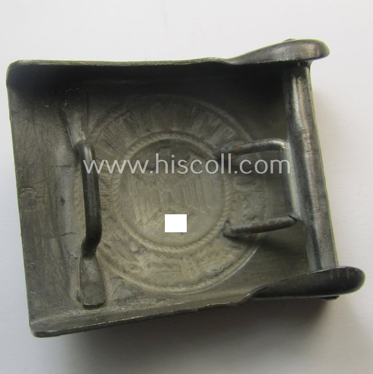 Moderately used, WH (Heeres) field-grey-coloured- and/or typical steel-based belt-buckle being a maker- (ie. 'GB') marked example
