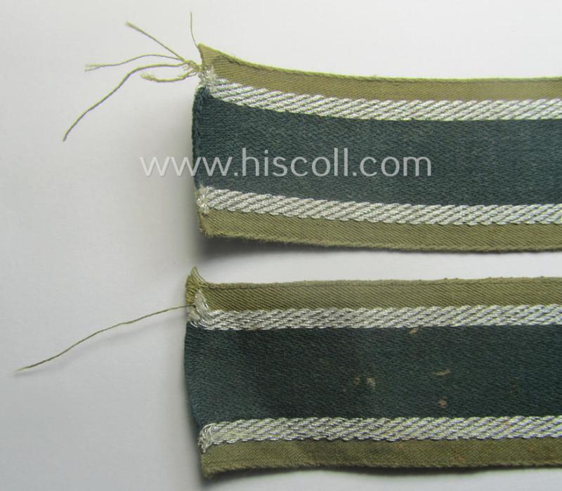 'BeVo'-like cuff-title (ie. 'Ärmelstreifen') entitled: 'Afrikakorps' being a presumably issued but simply never worn example that comes in an overall very nice- (ie. non-shortened- and never tunic-attached-), condition