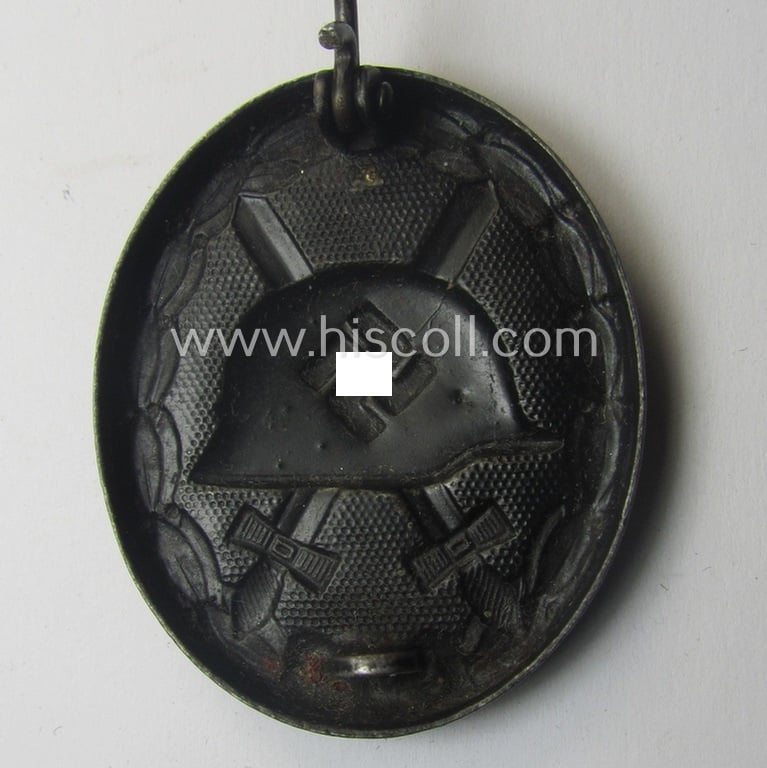 Black-class wound-badge (or: 'Verwundeten-Abzeichen in Schwarz') being a maker- (ie. '4'-) marked specimen as was produced by the maker (ie. 'Hersteller') named: 'Steinhauer & Lück'