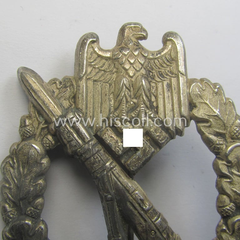 'Infanterie Sturmabzeichen in Silber' being a non-maker-marked and/or typical zinc- (ie. 'Feinzink'-) based version as was (I deem) procuded by the: 'Frank & Reif'-company