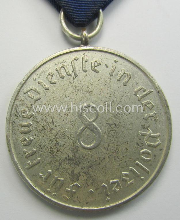 Bright-silver-toned so-called: 'Polizei-Dienstauszeichnung 3. Stufe' (or: police loyal-service medal 3rd class) that comes mounted onto its period ribbon (ie. 'Bandabschnitt')