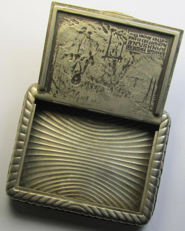 Unusal item that originated from a German soldier: a Russian, WWII-period, silver-toned tobacco-box showing a representation of Lenin coupled with some Cyrillic text (and that comes in a clearly used  condition)