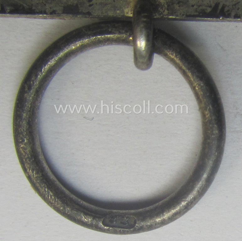 'EK II. Klasse' being a maker- (ie. '13'-) marked example that comes together with its original- and never-mounted ribbon (ie. 'Bandabschnitt') as was produced by the maker (ie. 'Hersteller'): 'Gustav Brehmer'