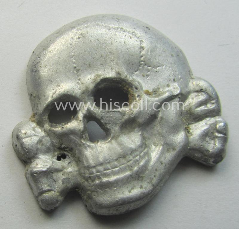 Superb - albeit regrettably incomplete but nevertheless rarely encountered! - 'Waffen-SS' visor-cap skull (ie. 'Totenkopf für Schirmmütze') being a detailed- and/or maker- (ie. 'RzM 499/41'-) marked example as was executed in 'Cupal'-based me...