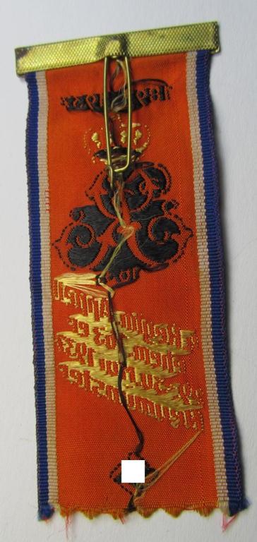 Neat, commemorative bright-orange-coloured- and/or: 'silk'-based so-called: 'Veranstaltungsabzeichen' depicting a swastika-device coupled with the text: '4. Regim. Appell ehem. 163er - 29.30. Mai 1937 - Neumünster'