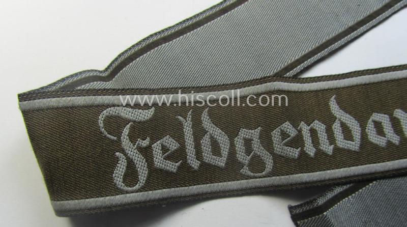 Hardly ie. never worn example of a WH (Heeres) cuff-title ie. armband (ie. 'Ärmelstreifen') entitled: 'Feldgendarmerie' (being a typical 'BeVo'-woven example)