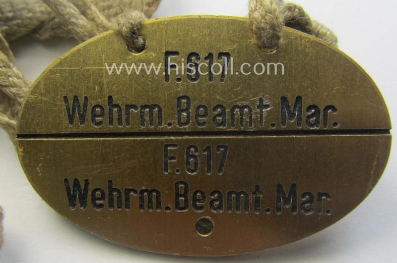 Unusually found - albeit 'standard-issue'-pattern - WH (Kriegsmarine) typical aluminium-based- and/or bright golden-bronze toned ID-disc (ie. 'Erkennungsmarke') bearing the engraved coded numeral (ie. text) that simply reads: 'F.617 Wehr.Beamt.M...