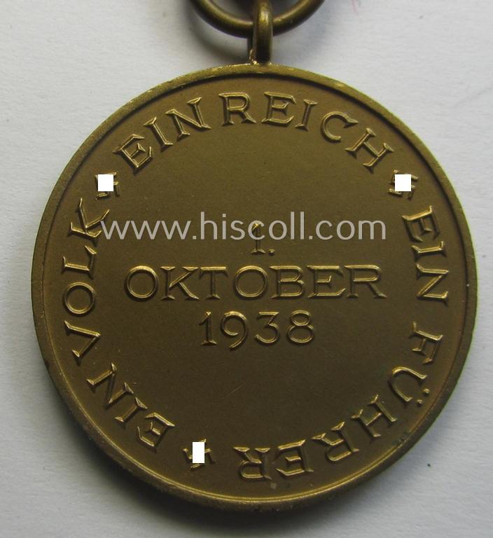 WH Czech-occupation- (ie. 'Anschluss'-) medal: '1. Oktober 1938' that comes mounted onto its period ribbon and that shows a firmly (and period!) attached 'Prager Burg-Spange' and that came with its accompanying 'Feld-/Bandspange'