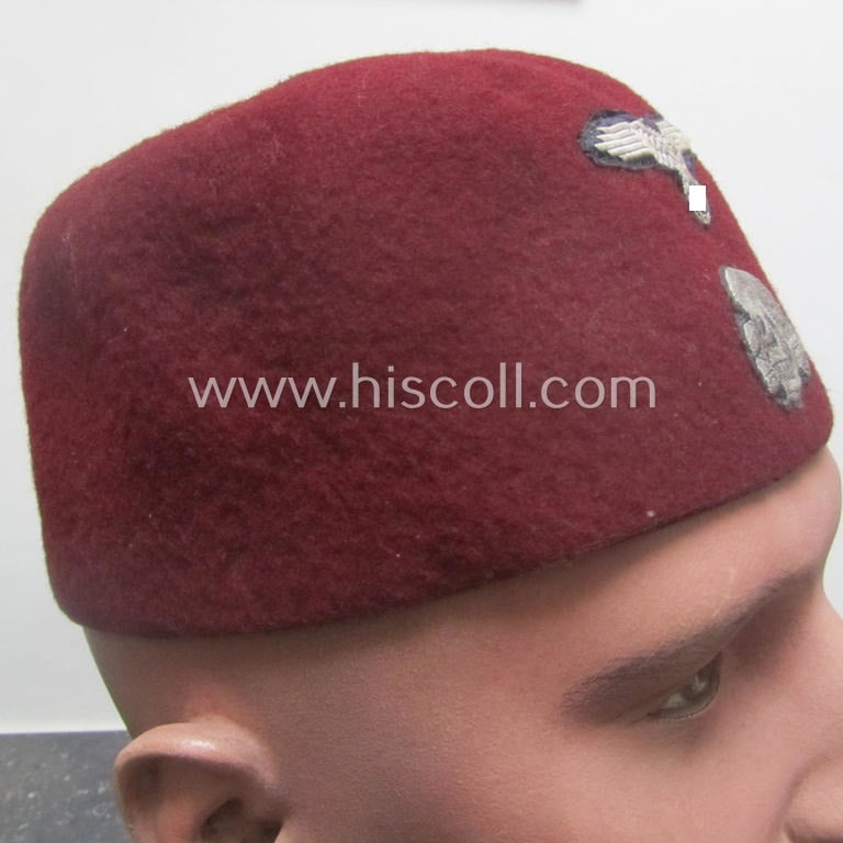 Maroon-red-coloured, Waffen-SS-pattern so-called: 'Fez' having a neat - and fully matching! - silver-grey-coloured- and/or 'BeVo'-woven insignia-set originally- (ie. 'off-factory'-) attached