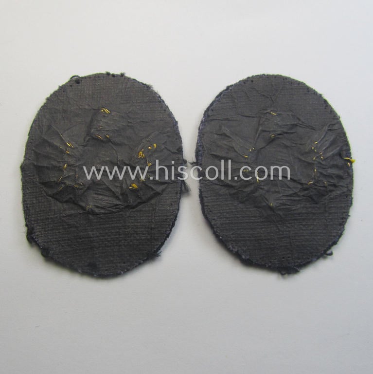 Fully matching set ie. pair of WH (Kriegsmarine) hand-embroidered career- ie. specialist-armbadges, as executed on dark-blue-coloured wool as intended for usage by an officer serving within a: 'Küstenartillerie'-unit