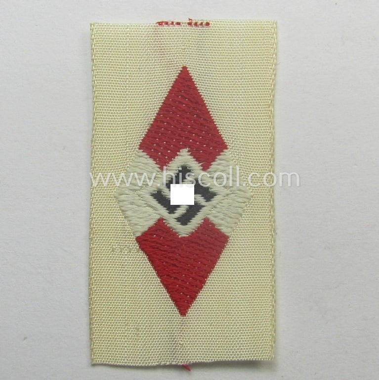 HJ (ie. 'Hitlerjugend') cap-badge (ie.: 'Raute') as executed in 'BeVo'-weave-pattern