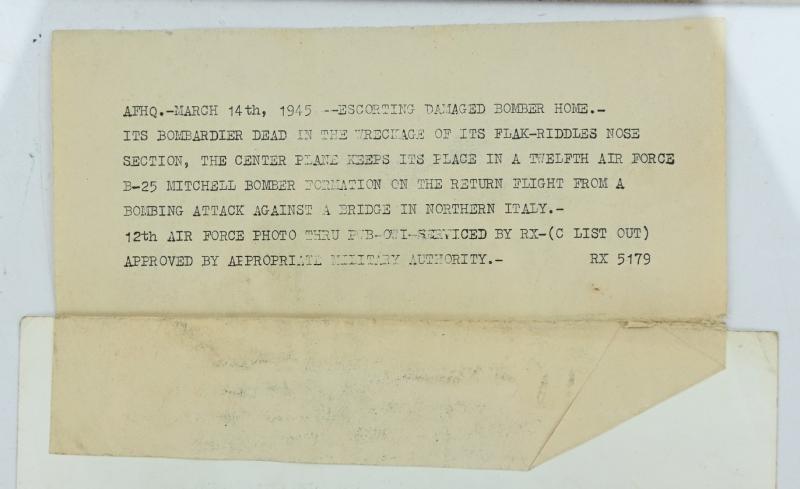 US WW2 Press Photo 'Flak damaged Bomber'