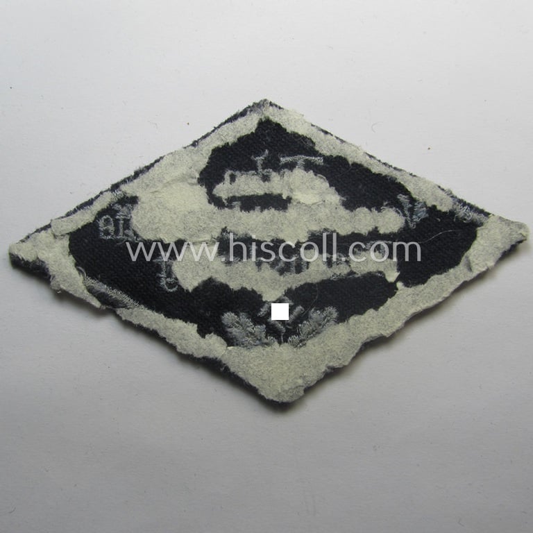 Unusual, HJ ('Hitlerjugend' ie. 'Flieger HJ'-) specialist armbadge (or: 'Schulabzeichen') depicting the text: 'Techn. Vorschule d. Luftwaffe - Braunschweig' and that comes in an overall nice- (ie. moderately used and/or tunic-removed-), condition