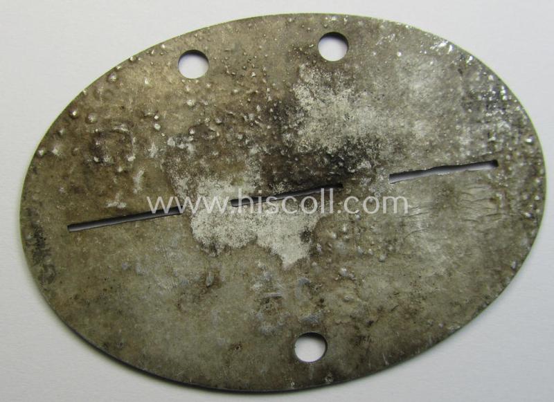 Interesting - and typical aluminium-based - WH (Heeres) ie. 'Truppen-Betreuungs'-related ID-disc (ie. 'Erkennungsmarke') bearing the stamped unit-designation that simply reads: '1.Tp.Betr.K.563'