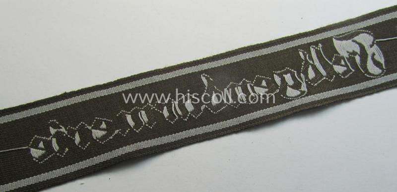 Superb - and scarcely encountered! - example of a WH (Heeres) cuff-title ie. armband (ie. 'Ärmelstreifen') entitled: 'Feldgendarmerie' (being a typical 'semi-BeVo'-woven!) example that comes in a full length- ie. non-shortened, condition