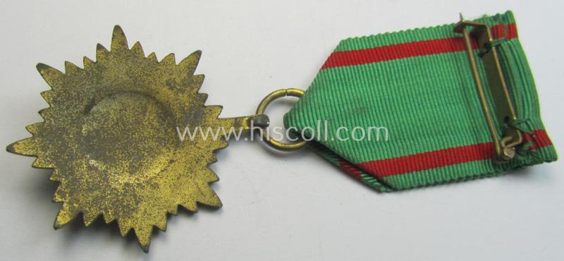 WH-related so-called: 'Verdienstauszeichnung für Angehörige der Ostvölker, 2. Klasse in Gold ohne Schwerter', being a nicely maker- (ie. '100'-) marked- and/or: 'Feinzink'-based example that comes mounted on its period ribbon